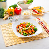 Fototapeta Tulipany - sweet and sour chicken with rice and vegetables