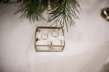 wedding gold rings on a ceremony table