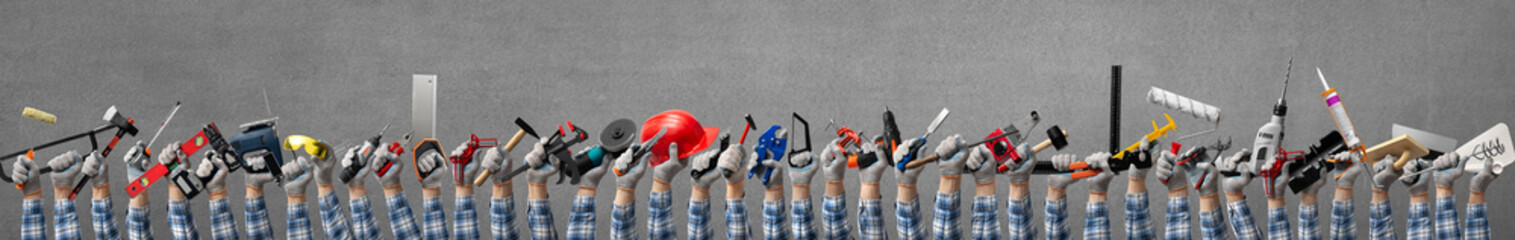 Wall Mural - group of hands holds a construction tools for woodworking, construction and repair