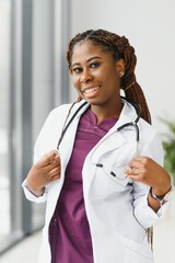 Wall Mural - portrait of african female doctor at workplace