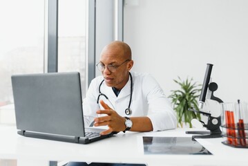 Wall Mural - young male african doctor in hospital