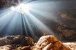 Sun Beams Shine Down Through Cave