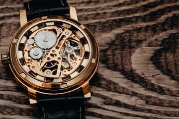 Mechanism, clockwork of a watch with jewels, close-up. Vintage luxury background. Time, work concept.