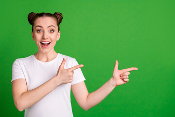 Poster - Photo of excited lady indicate forefinger empty space open mouth wear white t-shirt isolated green background