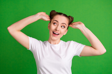 Canvas Print - Portrait of attractive feminine cheerful girl enjoying new hairdo having fun isolated over bright green color background