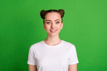 Wall Mural - Photo of charming young lady toothy beaming smile look camera wear white t-shirt isolated green background