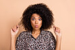 © deagreez - Photo portrait of curly woman touching hairdo staring amazed shocked face isolated pastel beige color background