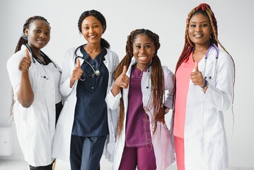 Wall Mural - group of african doctor and nurse giving thumbs up