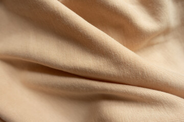 Canvas Print - Folded simple beige cotton jersey fabric from above
