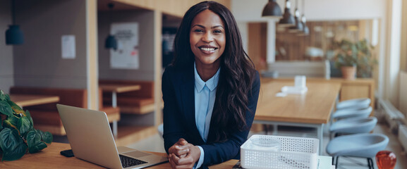 Wall Mural - Confident young African American businesswoman working in an office lounge