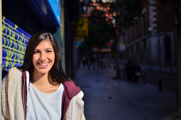 Pretty Woman with radiant smile in the city