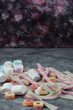 Mix of marshmallow and jellybeans on the marble background
