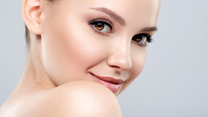 beautiful face of young smiling woman with clean fresh skin - isolated. young white happy woman with