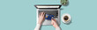 ノートパソコンで、クレジットカード番号を入力している女性の手。ネットショッピングのイメージ。真上からのアングル