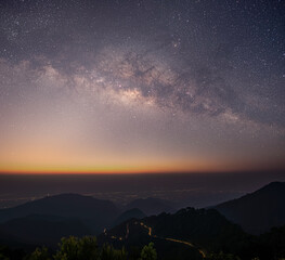 Wall Mural - The stars and the milky way in the dark night sky are very beautiful.