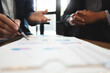 © mojo_cp - Business partners discussing brainstorming ideas at meeting business project.