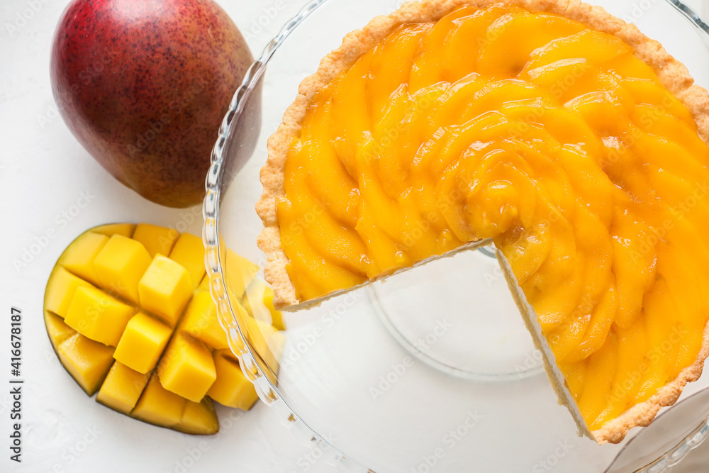 Tasty mango pie on light background