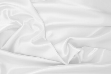 Smooth elegant white silk or satin luxury cloth texture as wedding background. Luxurious background design