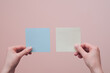 Female hands holding blank sticky post-it notes