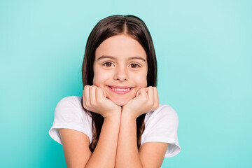 Sticker - Photo of shiny sweet little girl wear white t-shirt smiling arms chin cheek isolated turquoise color background