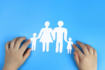 Wall Mural - Baby's hands support Paper family