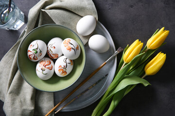 Wall Mural - Flat lay composition with painted Easter eggs on dark table