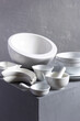 © Sergii Moscaliuk - Empty crockery or ceramic dishes set. Kitchen dishware and tableware on grey near wall background