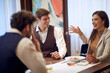 © luckybusiness - A group of business partners having a good time at a lunch at the restaurant. Business, restaurant, lunch