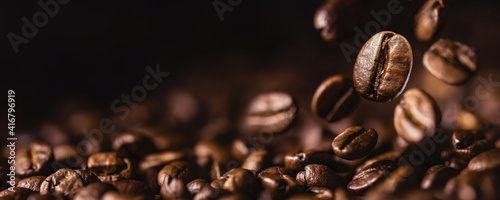 Brown Roasted Coffee Beans Closeup On Dark Background © Pasko Maksim 