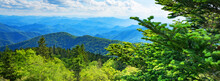 A Panoramic View Of The Smoky Mountains From The Blue Ridge Parkway In North Carolina. Blue Sky With  Clouds Over Layers Of Green Hills And  Mountains. North Carolina. Image For Banner And Web Header.