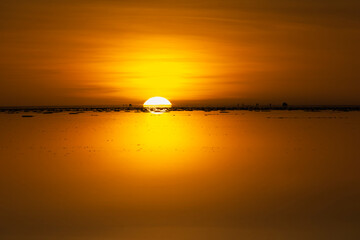 Canvas Print - Sunset on the salt flat covered with water, Salar de Uyuni, Potosi Department, Bolivia