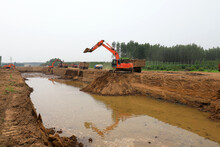 Excavator Operation In Flood Control Engineering Construction Site