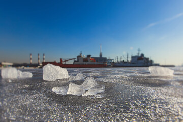 massive different ship vessels trapped in ice tries to break and leave the bay between the glaciers,