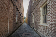 Lodge Alley In Charleston, South Carolina Is One Of City's Few Remaining Cobblestone Streets. Charleston Is Famous For It's Hidden And Secret Alleyways And This One Dates Back To The Early 1700s.