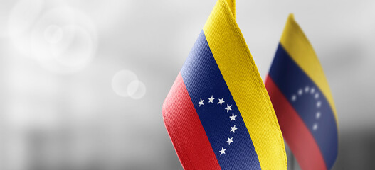 Wall Mural - Small national flags of the Venezuela on a light blurry background
