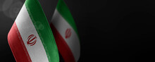 Small National Flags Of The Iran On A Dark Background