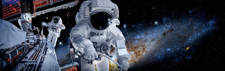 Wall Mural - Astronaut spaceman do spacewalk while working for space station in outer space . Astronaut wear full spacesuit for space operation . Elements of this image furnished by NASA space astronaut photos.