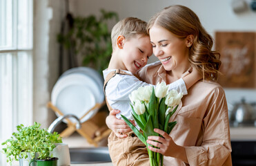 Wall Mural - happy woman and boy with flowers touching forehead