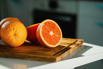 Healthy food. Vegetarian food. There are products on a white table. Real live vitamin C. Healthy lifestyle. Fresh delicious clean. Copy space. Seasonal Citrus fruits Red oranges grapefruit.