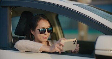 Poster - Woman use cellphone to take photo on car