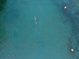 Young adult male swimming on a beach of mallorca. Concept of holiday, summer, relax, enjoy and relax	