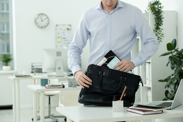 Poster - Businessman putting protective mask and clipboard with document into handbag
