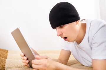 Poster - Young Man with a Tablet