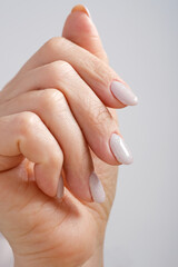 Wall Mural - Close-Up Of Woman Fingers With Nail Art. Woman Hand With Pearl Nail Polish