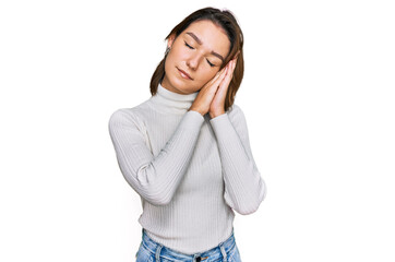 Young caucasian girl wearing casual clothes sleeping tired dreaming and posing with hands together while smiling with closed eyes.