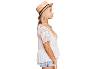 Sticker - Young blonde girl wearing summer hat looking to side, relax profile pose with natural face with confident smile.