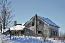 Old Abandoned Farm House In Snow