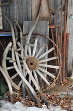 Old Wagon Wheel And Farm Tools