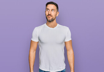 Sticker - Handsome man with beard wearing casual white t shirt smiling looking to the side and staring away thinking.