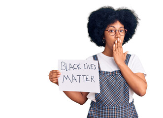 Wall Mural - Young african american girl holding black lives matter banner covering mouth with hand, shocked and afraid for mistake. surprised expression